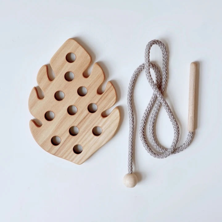 Wooden lacing toy